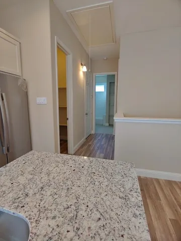 a view of a bathroom with a sink and a mirror
