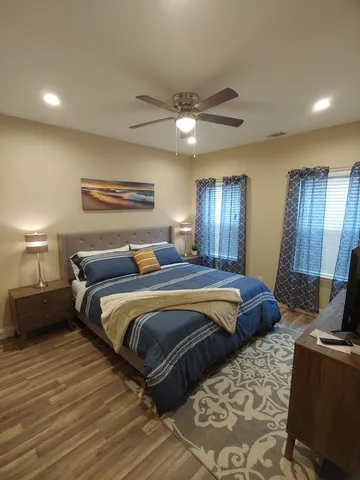 a bed room with bed and window