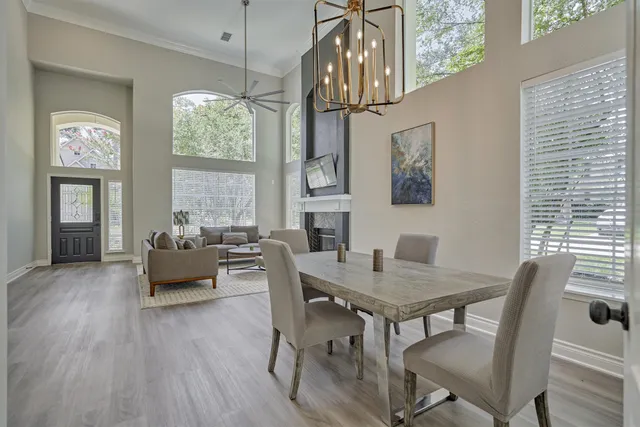 a view of a dining room with furniture window and wooden floor