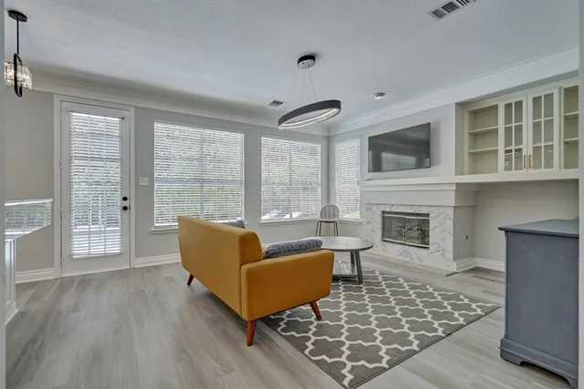 a living room with furniture and a fireplace