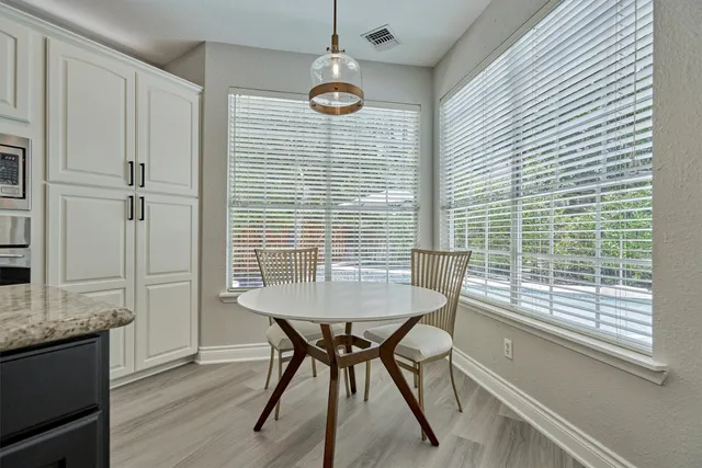 a kitchen with stainless steel appliances a refrigerator sink and cabinets