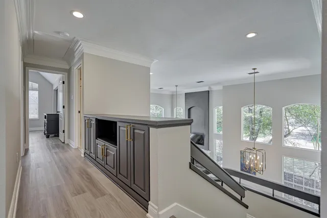 a bathroom with double vanity and a mirror