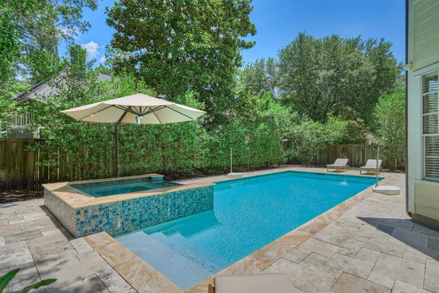 a wooden bench sitting in the middle of a yard