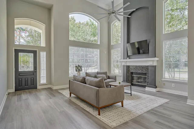 a living room with furniture and a fireplace