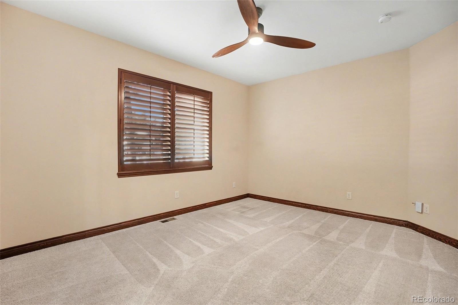 7936 Monarch Road Larkspur, CO 80118 - Photo 15 of 24 a view of an empty room with a window