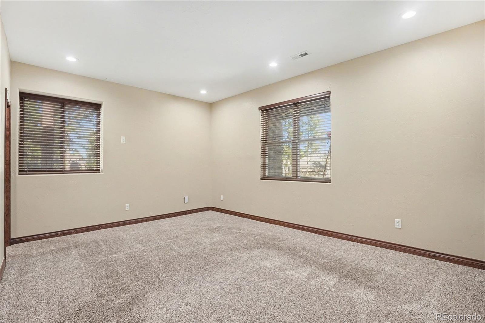 7936 Monarch Road Larkspur, CO 80118 - Photo 21 of 24 an empty room with windows