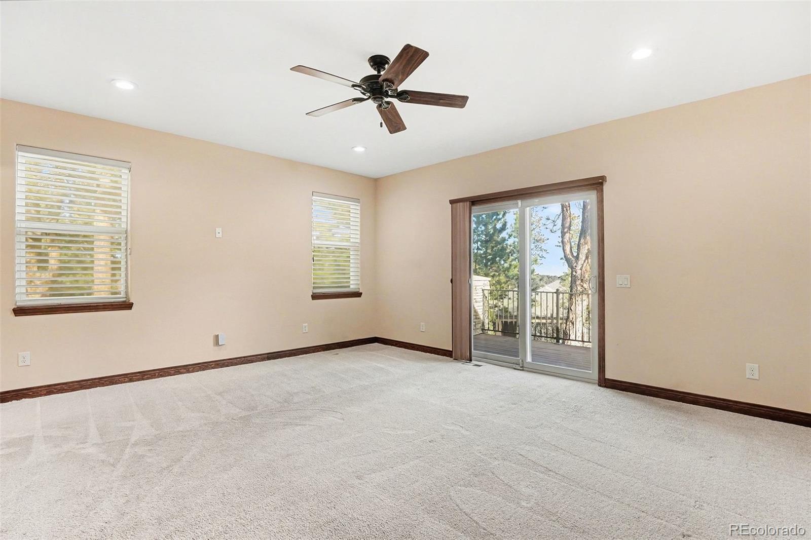 7936 Monarch Road Larkspur, CO 80118 - Photo 10 of 24 a view of an empty room with a window