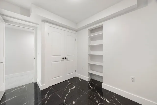 a view of an empty walk in closet