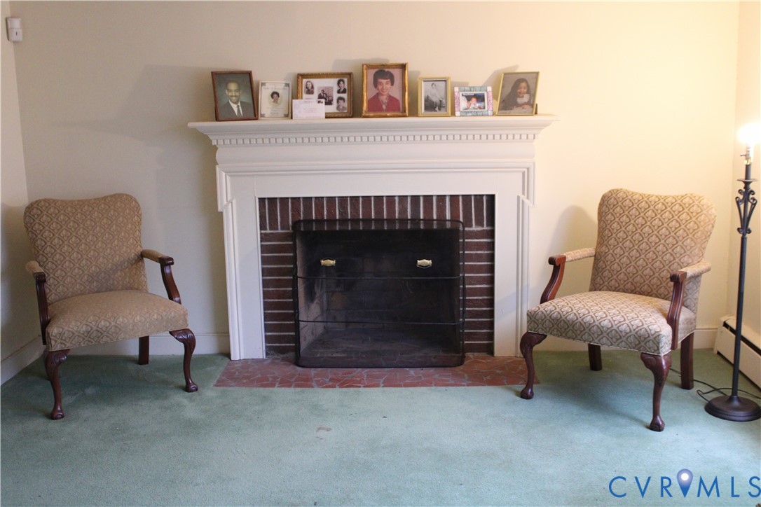 1215 Whitby Road Richmond, VA 23227 - Photo 2 of 13 Living area featuring carpet and a brick fireplace