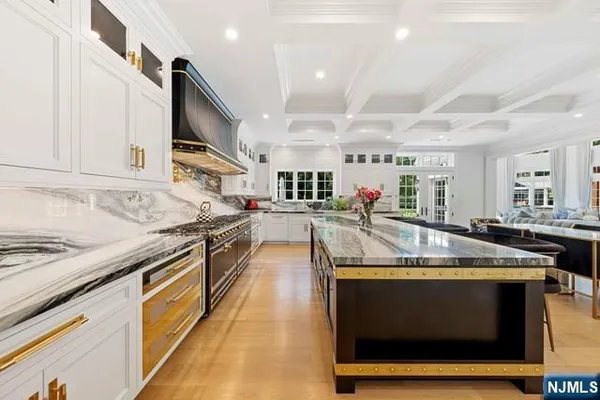 a kitchen with stainless steel appliances granite countertop a stove and a sink