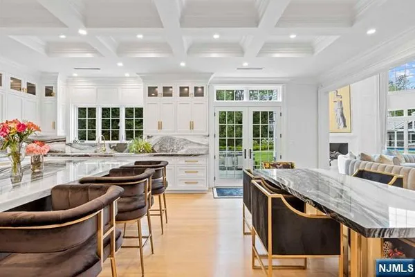 a kitchen with counter top space a sink and appliances
