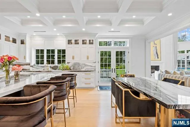 a kitchen with counter top space a sink and appliances