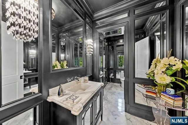 a spacious bedroom with a large bed and a flat screen tv