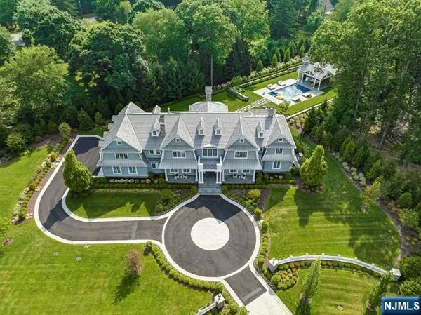 a wooden floor with some trees and plants in the back yard