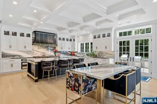 a kitchen with stainless steel appliances granite countertop a stove and a sink