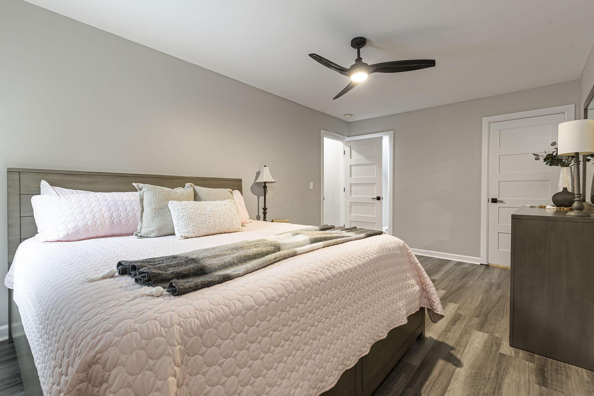 7140 Cook Road Powell, OH 43065 - Photo 53 of 87 Wood-finish flooring, recessed lighting, and a ceiling fan with integrated lighting