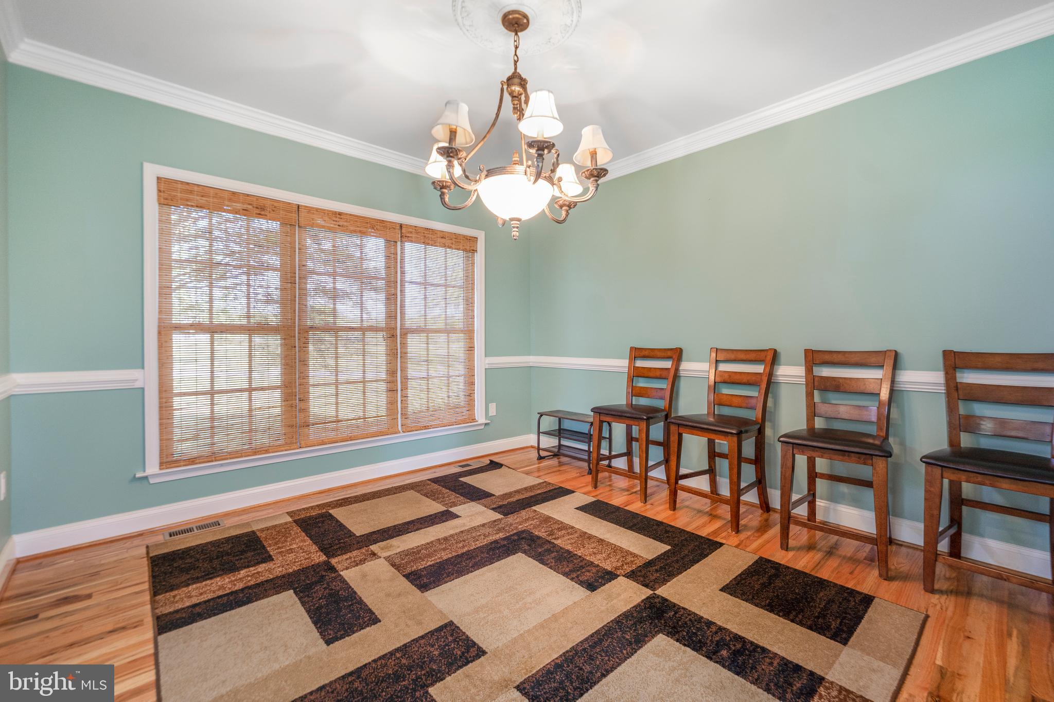 5100 Williams Wharf Road St. Leonard, MD 20685 - Photo 16 of 63 a living room with lots of furniture and a chandelier