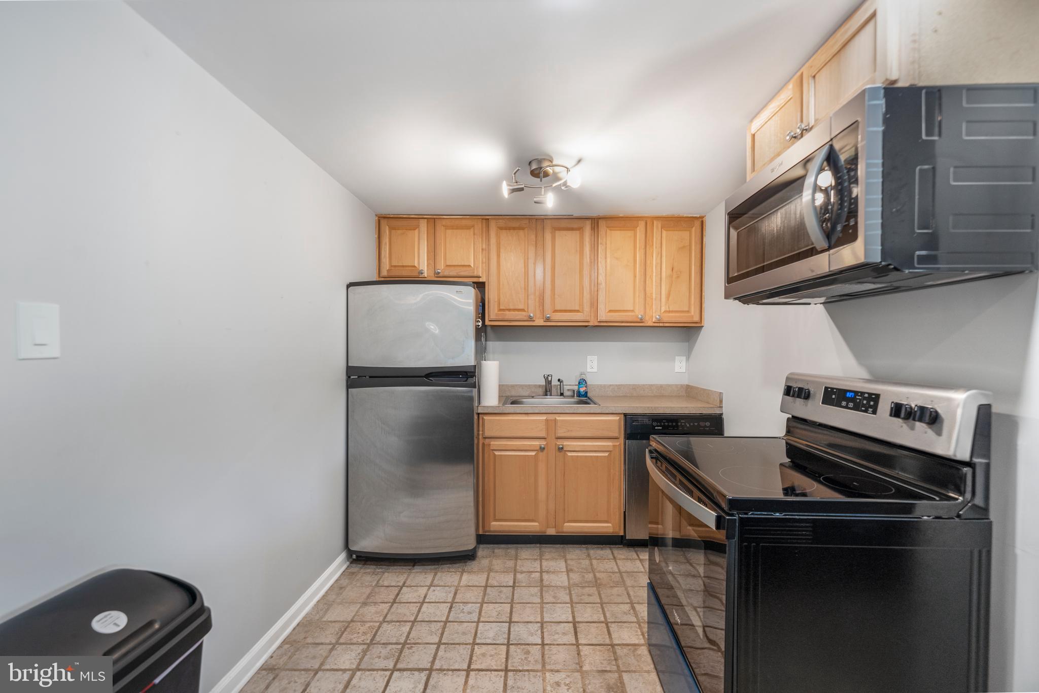 5100 Williams Wharf Road St. Leonard, MD 20685 - Photo 37 of 63 a kitchen with a stove microwave and sink