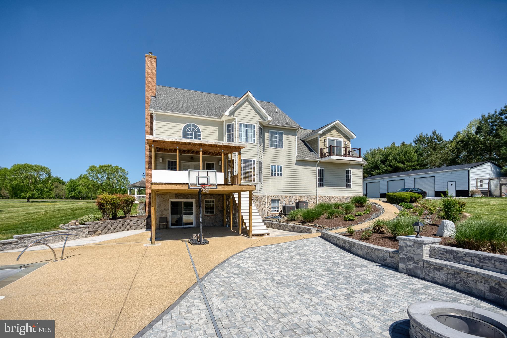 5100 Williams Wharf Road St. Leonard, MD 20685 - Photo 40 of 63 a front view of a house with a yard and garage