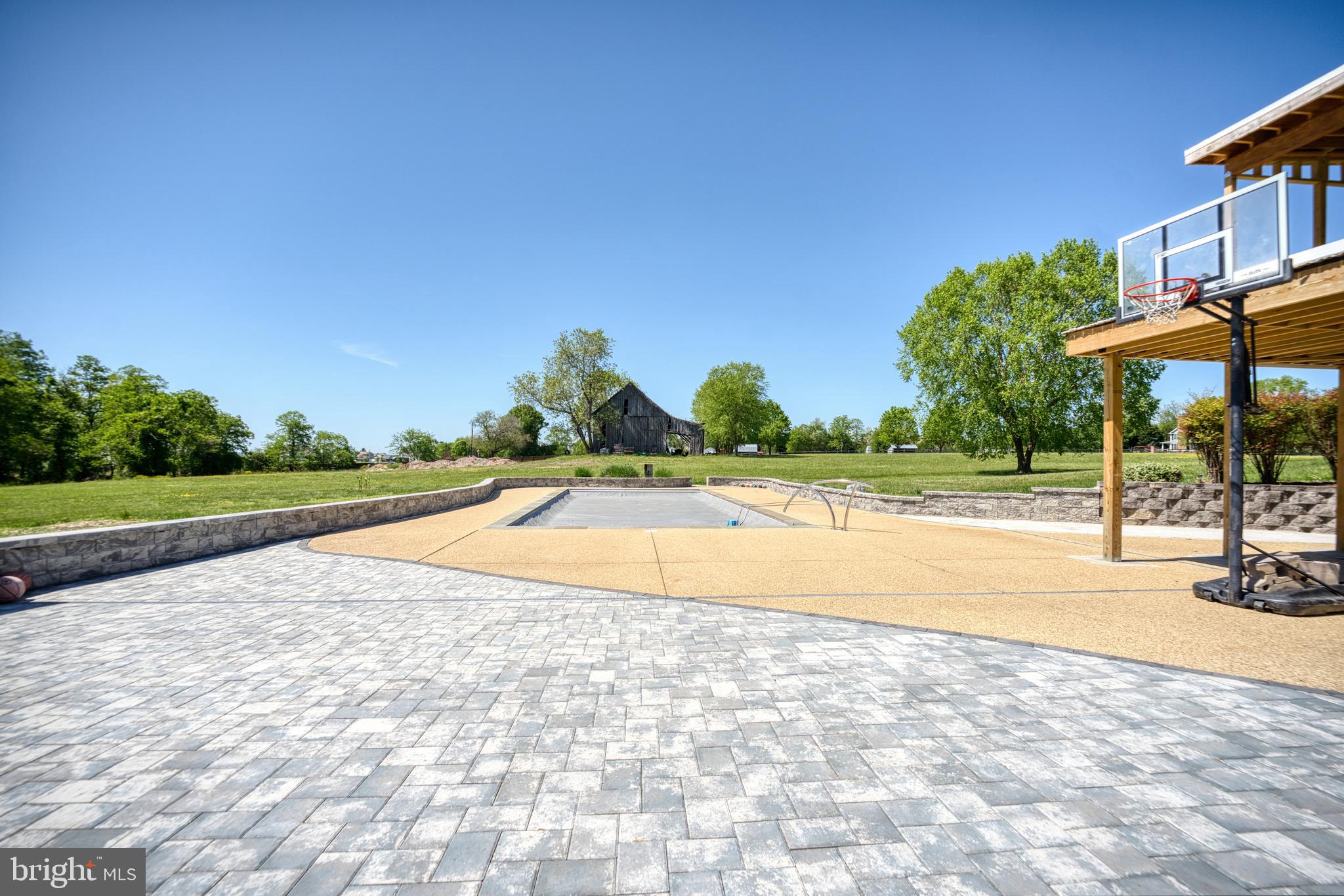 5100 Williams Wharf Road St. Leonard, MD 20685 - Photo 43 of 63 a view of a swimming pool with a yard and sitting area