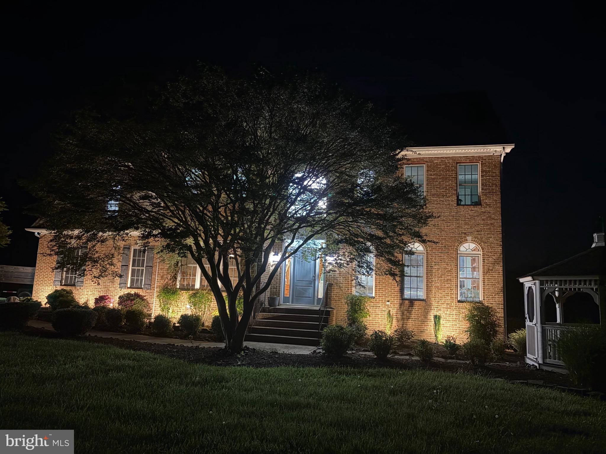 5100 Williams Wharf Road St. Leonard, MD 20685 - Photo 54 of 63 a front view of a house with a garden