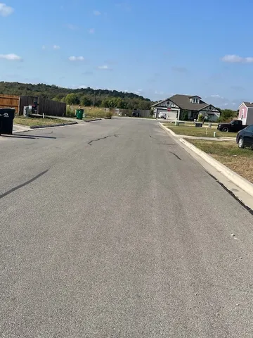 a view of a swimming pool and an outdoor seating