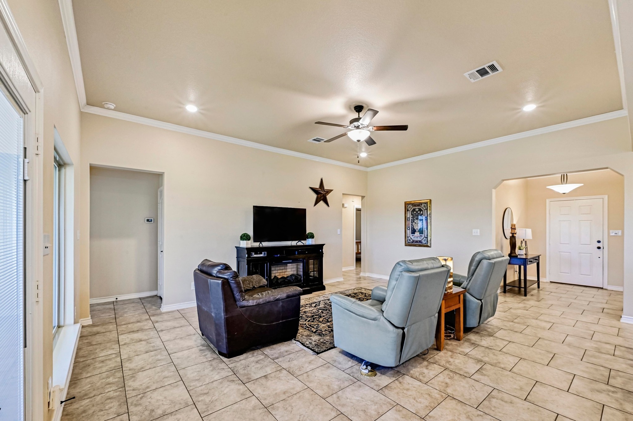 560 Saddle Ridge Drive Bertram, TX 78605 - Photo 6 of 27 a living room with furniture and a flat screen tv
