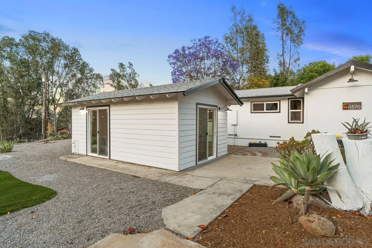 11570 Johnson Lake Road Lakeside, CA 92040 - Photo 28 of 36 a view of a house with a yard and potted plants
