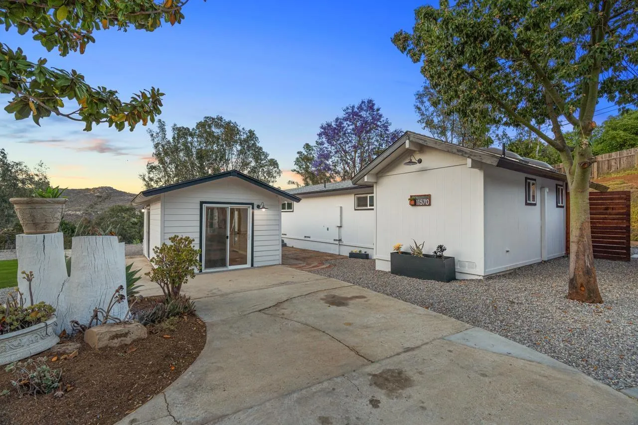 11570 Johnson Lake Road Lakeside, CA 92040 - Photo 31 of 36 a view of a house with a yard and large tree