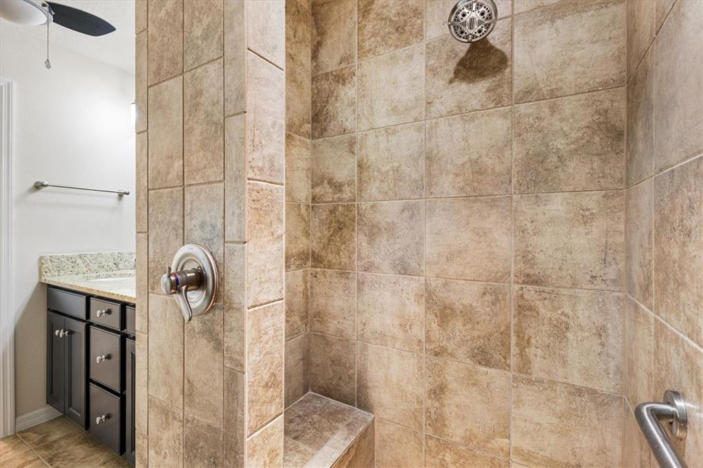 7351 Southeast 169th Cote Loop The Villages, FL 32162 - Photo 17 of 32 a bathroom with a shower