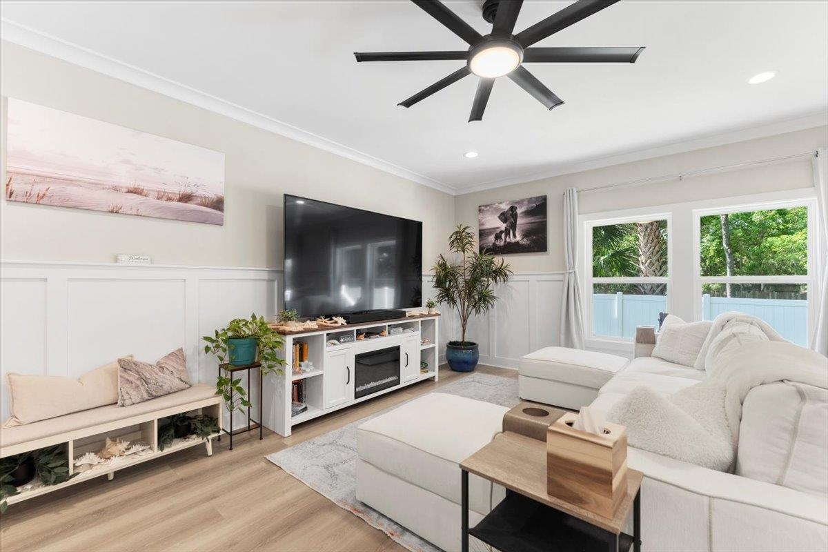 633 West Pope Road St. Augustine, FL 32080 - Photo 13 of 43 a living room with furniture and a flat screen tv