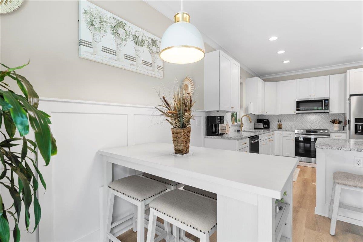 633 West Pope Road St. Augustine, FL 32080 - Photo 16 of 43 a kitchen with a refrigerator and a sink