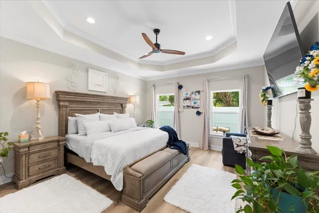 a bedroom with a bed window and flowerpot
