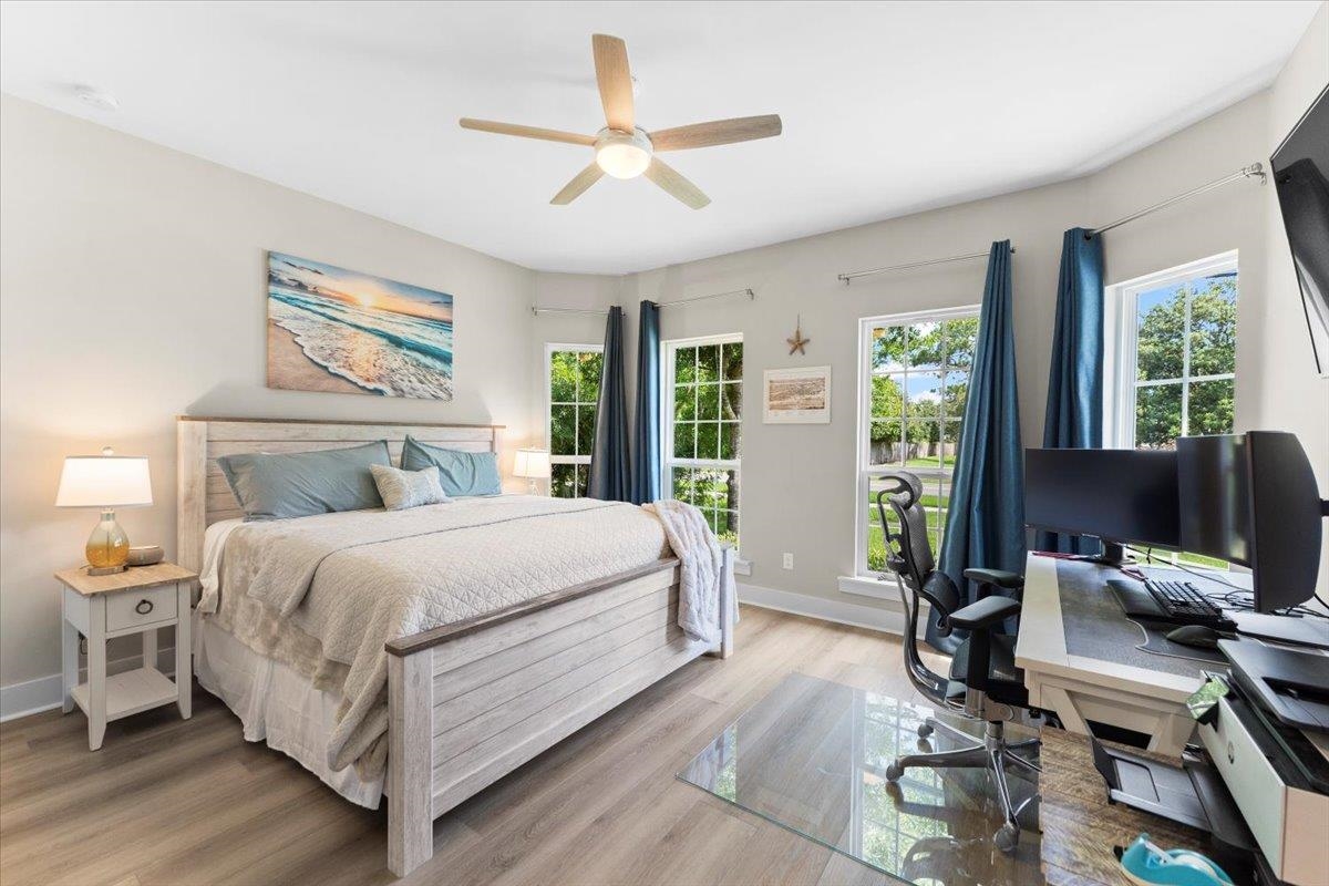 633 West Pope Road St. Augustine, FL 32080 - Photo 25 of 43 a bedroom with a large bed and large windows