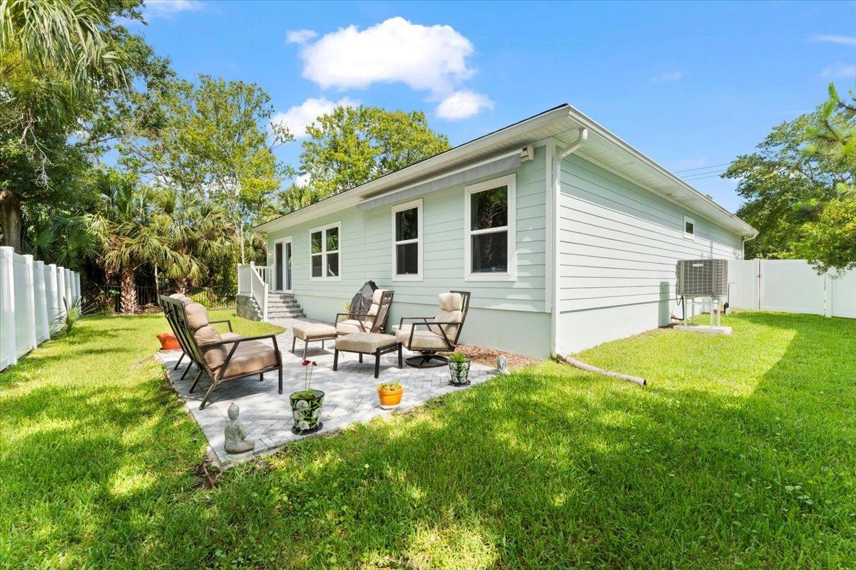 633 West Pope Road St. Augustine, FL 32080 - Photo 28 of 43 a view of a house with backyard and sitting area