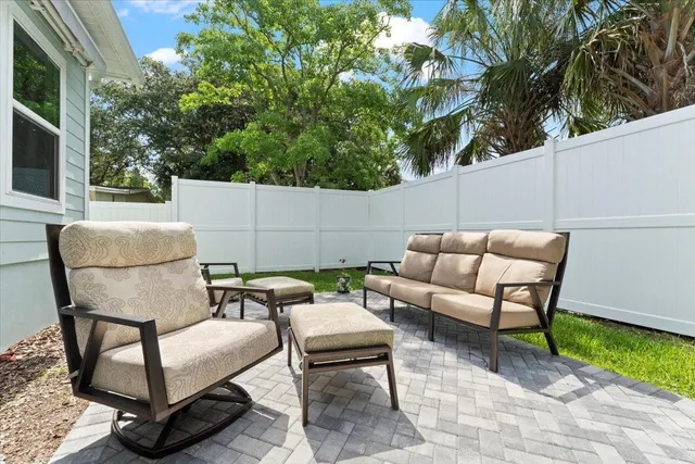 a building outdoor space with patio couch and a potted plant