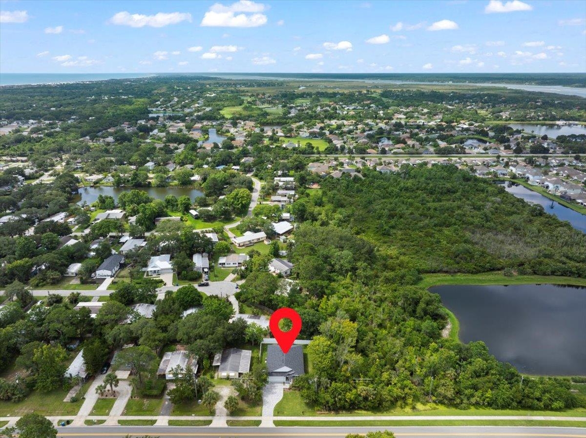 633 West Pope Road St. Augustine, FL 32080 - Photo 41 of 43 an aerial view of residential houses with outdoor space and lake view