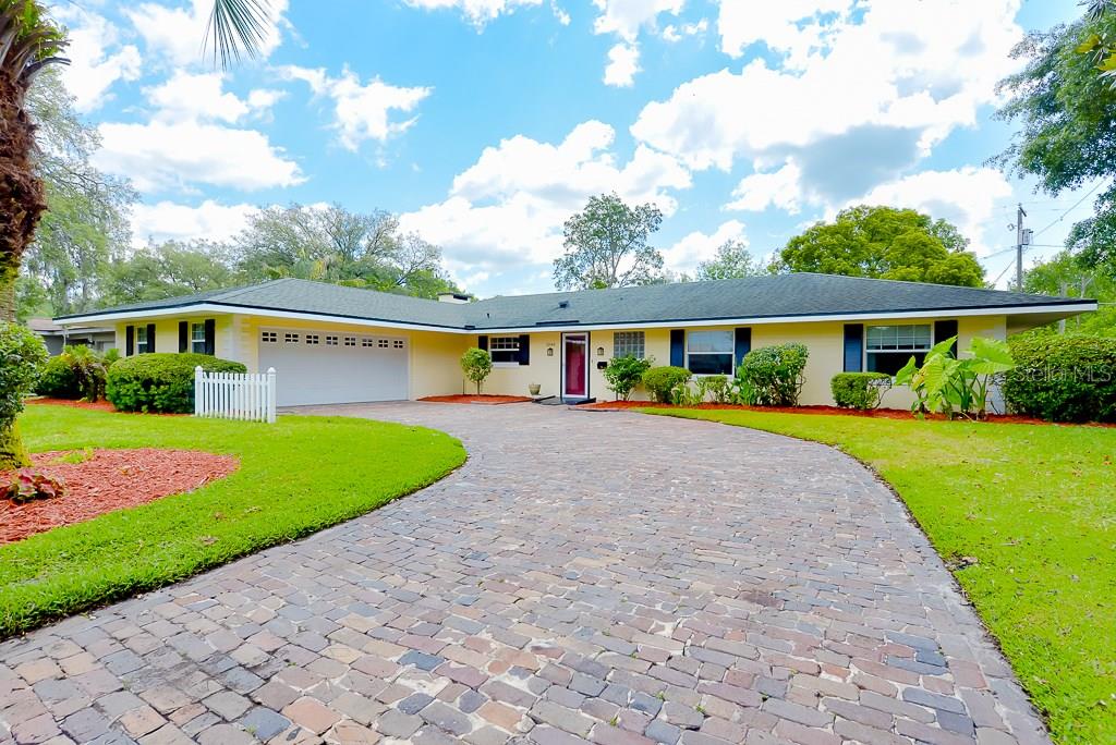 1240 Winston Road Maitland, FL 32751 - Photo 1 of 1 Front exterior with Brick paved driveway and side entry garage