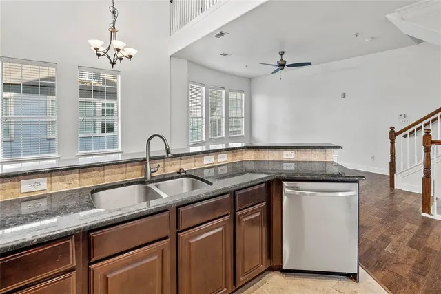 a kitchen with a sink and cabinets