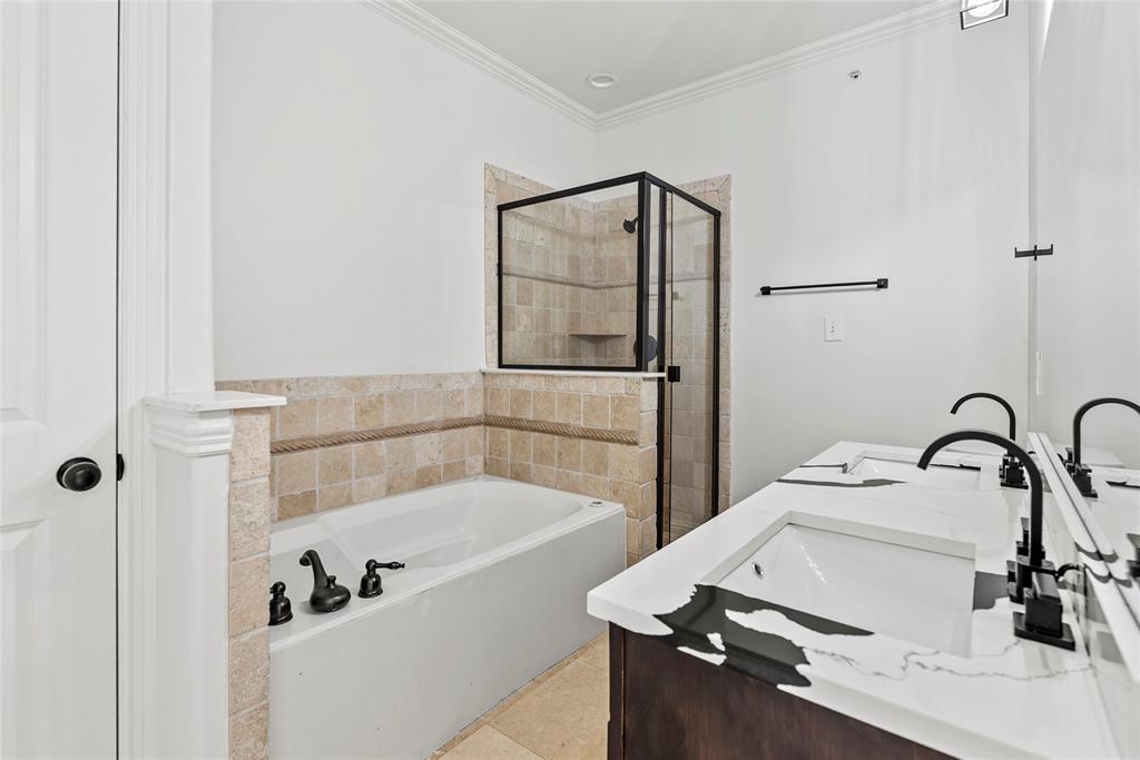 2316 Stutz Drive, Unit A Dallas, TX 75235 - Photo 13 of 24 a bathroom with a tub sink and mirror