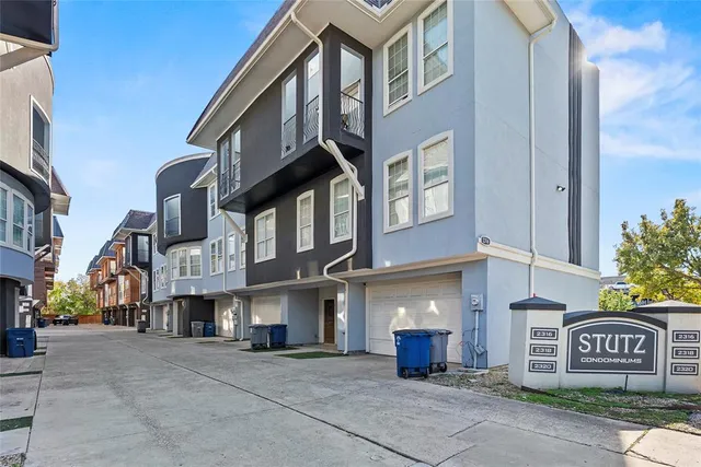 a front view of a house with a garage