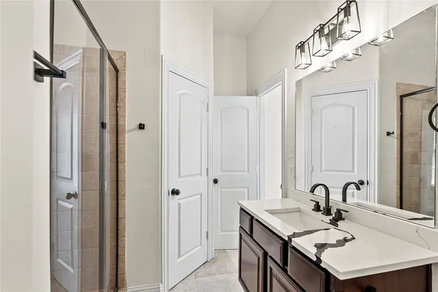 a bathroom with a sink and mirror