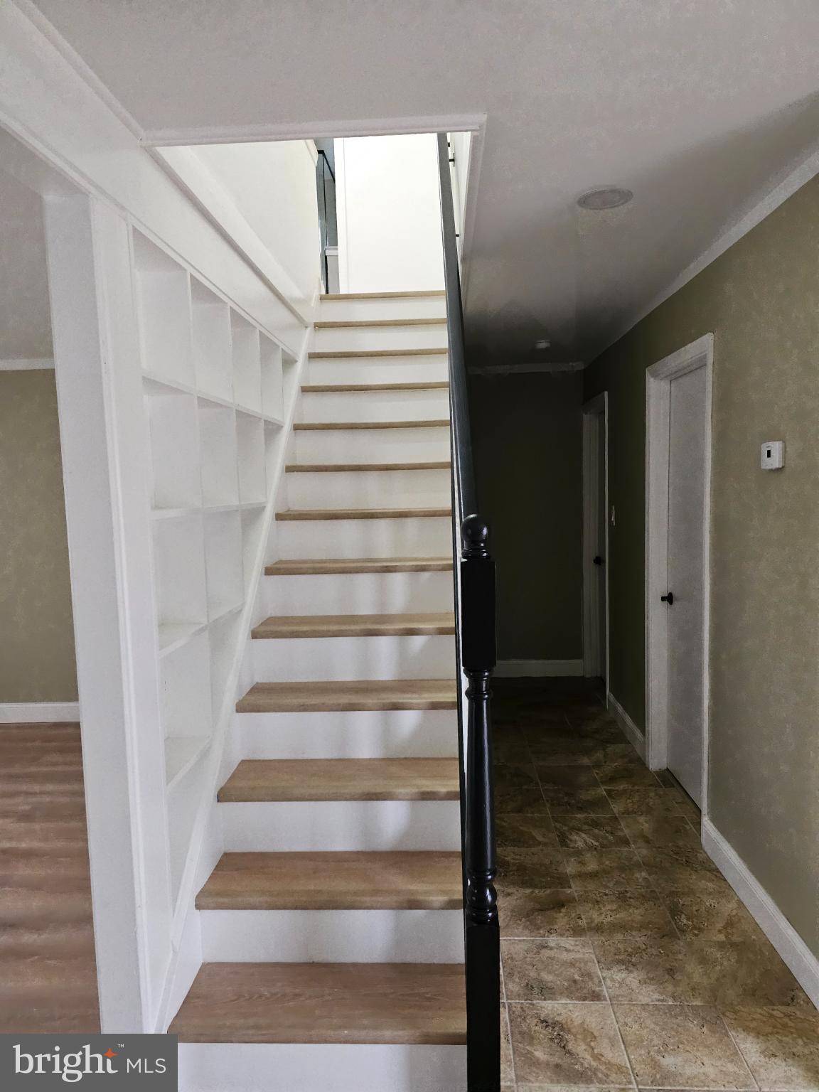 65 Silverspruce Road Levittown, PA 19056 - Photo 18 of 24 Inviting staircase with modern design elements.