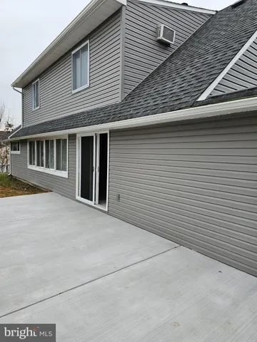 a view of a house with large windows