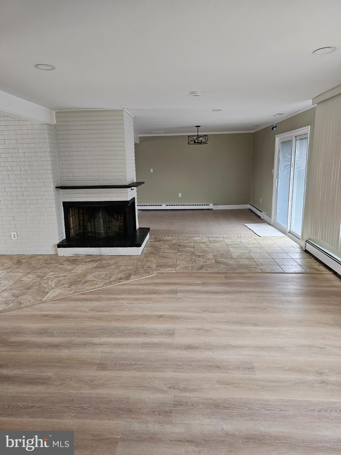 65 Silverspruce Road Levittown, PA 19056 - Photo 4 of 24 Living room open to dining room with sliders