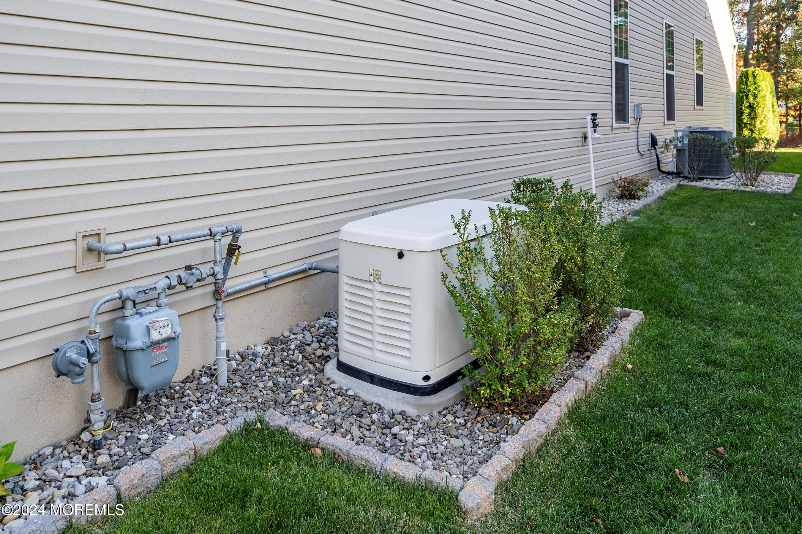 92 Ambermist Way Forked River, NJ 08731 - Photo 33 of 51 a view of a backyard with chairs and plants