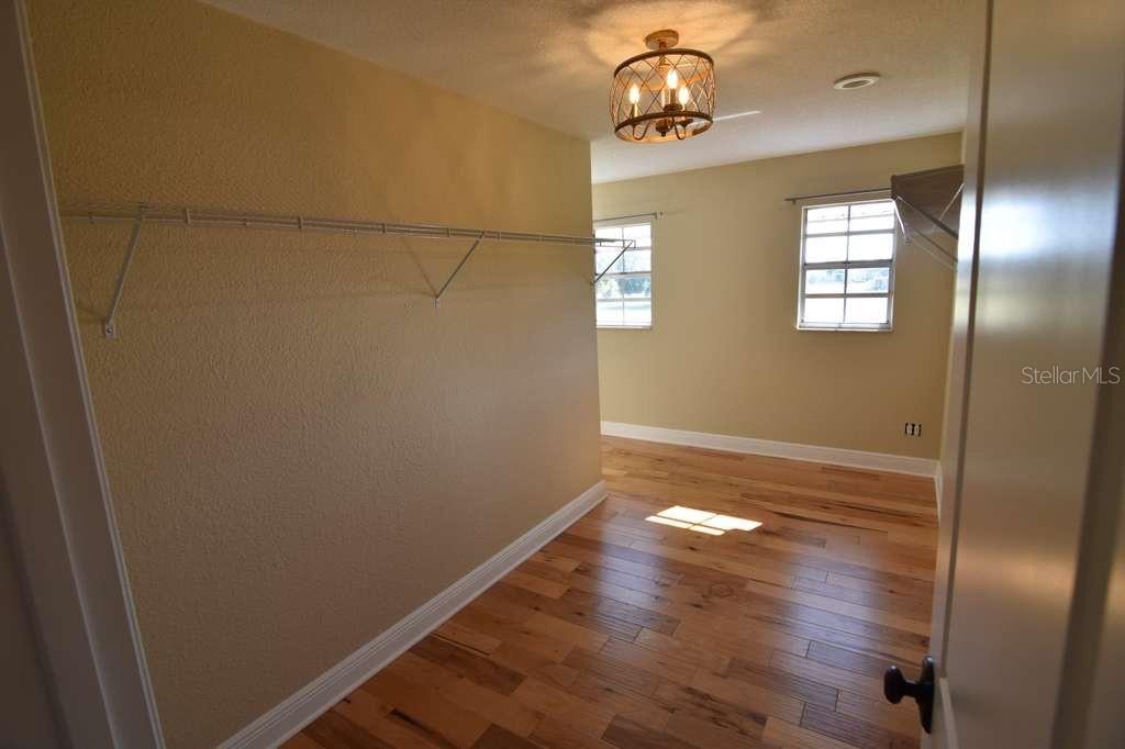3233 Hickory Tree Road St. Cloud, FL 34772 - Photo 17 of 23 a view of empty room with wooden floor