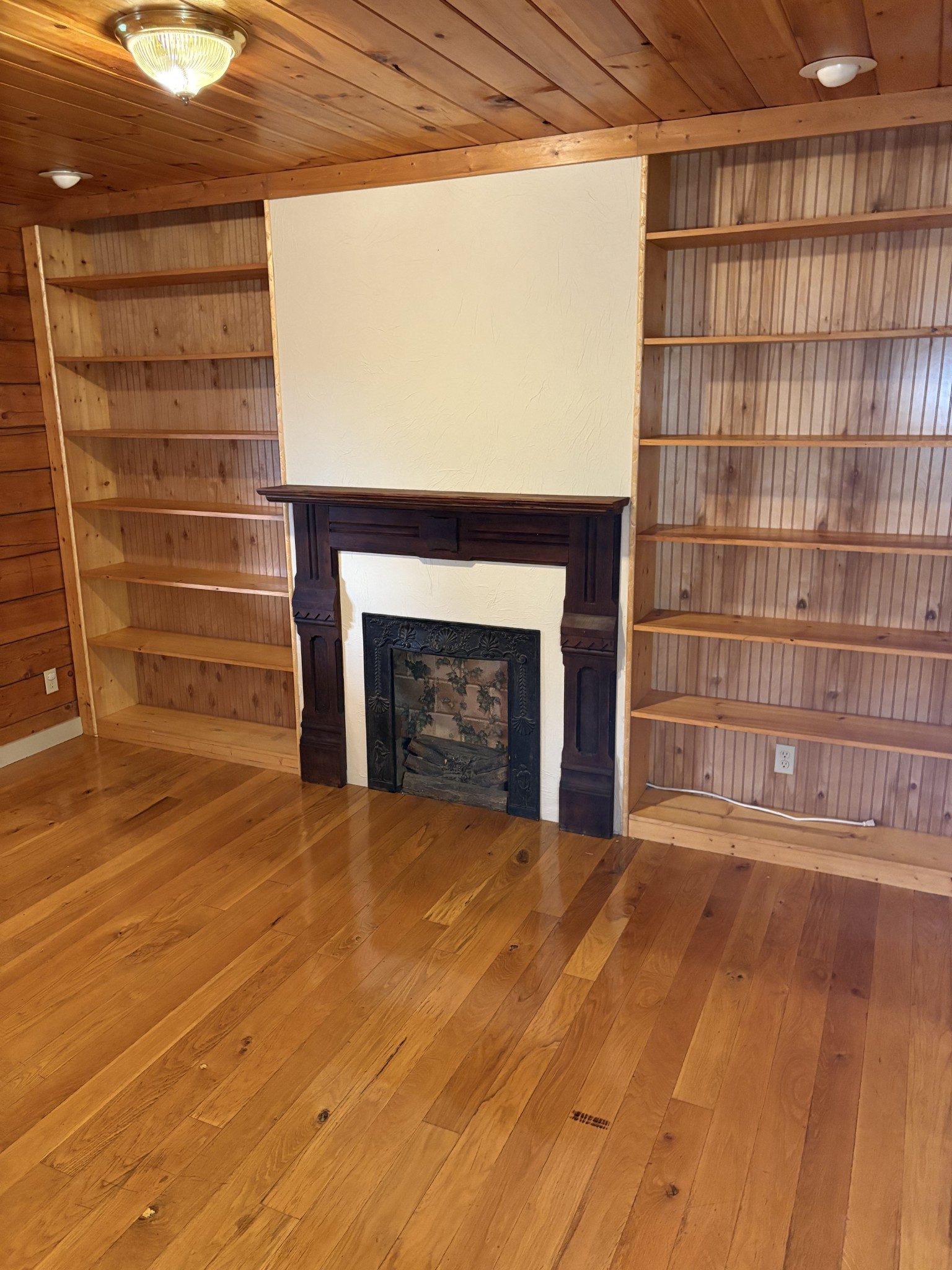 1028 Cook Road Liberty, TN 37095 - Photo 21 of 33 a view of empty room with wooden floor and fireplace