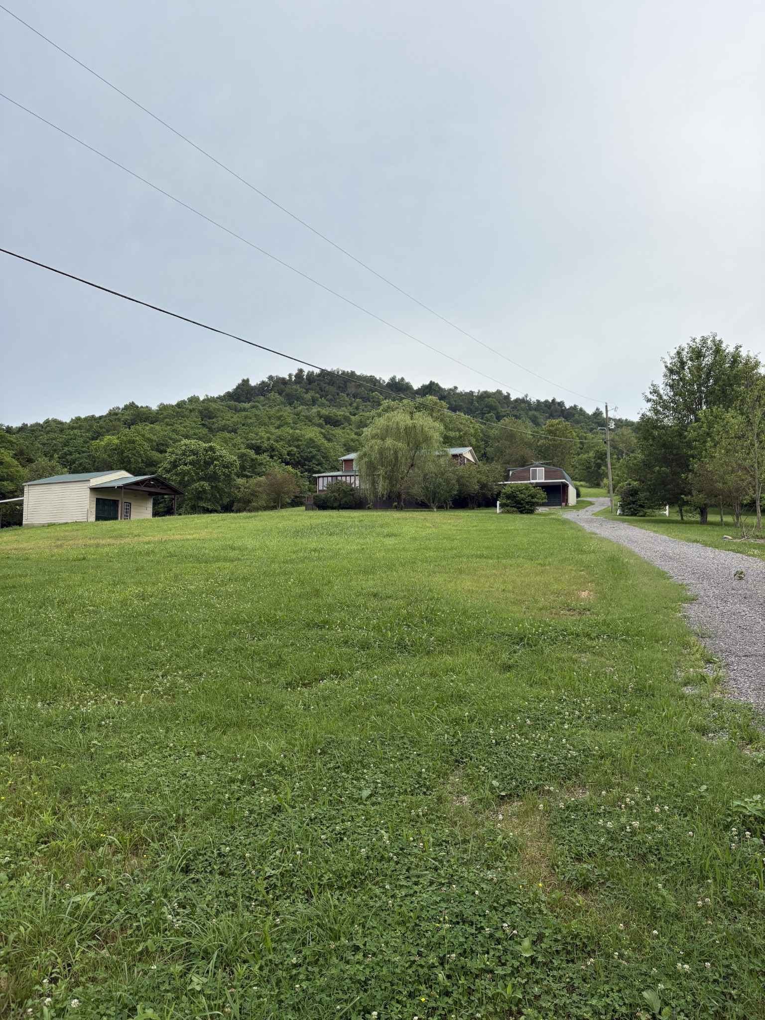 1028 Cook Road Liberty, TN 37095 - Photo 4 of 33 a view of a field with grass and a fence