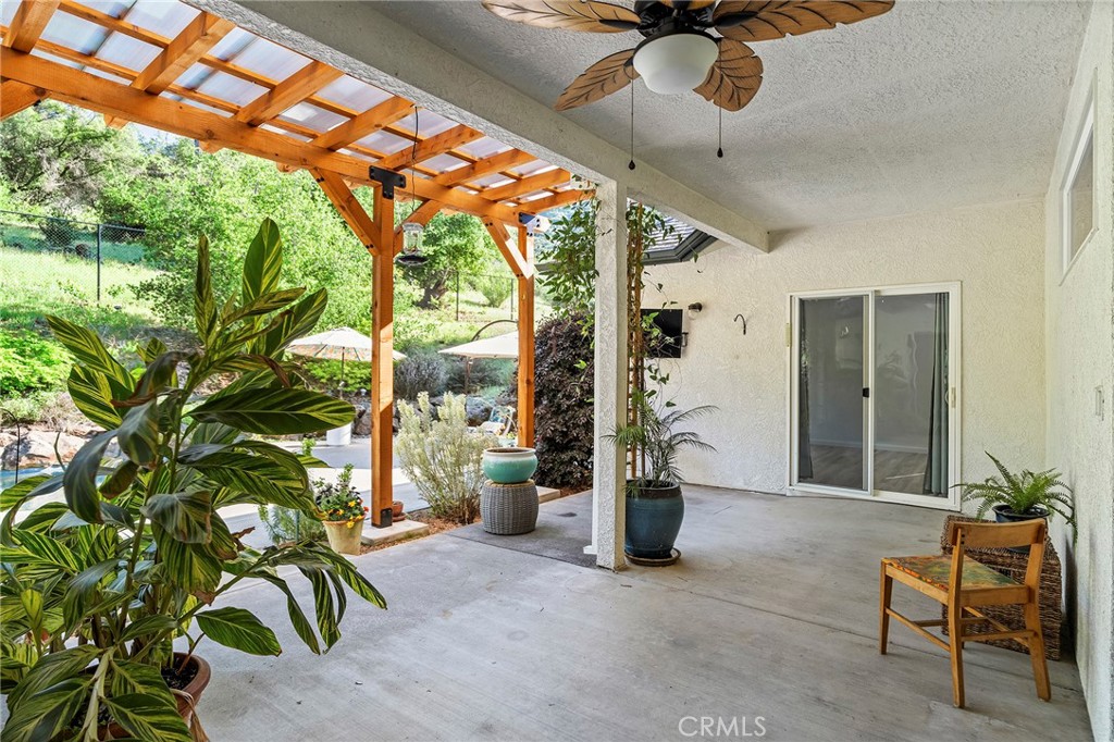 2262 Honey Run Road Chico, CA 95928 - Photo 40 of 74 a patio with table and chairs and potted plants